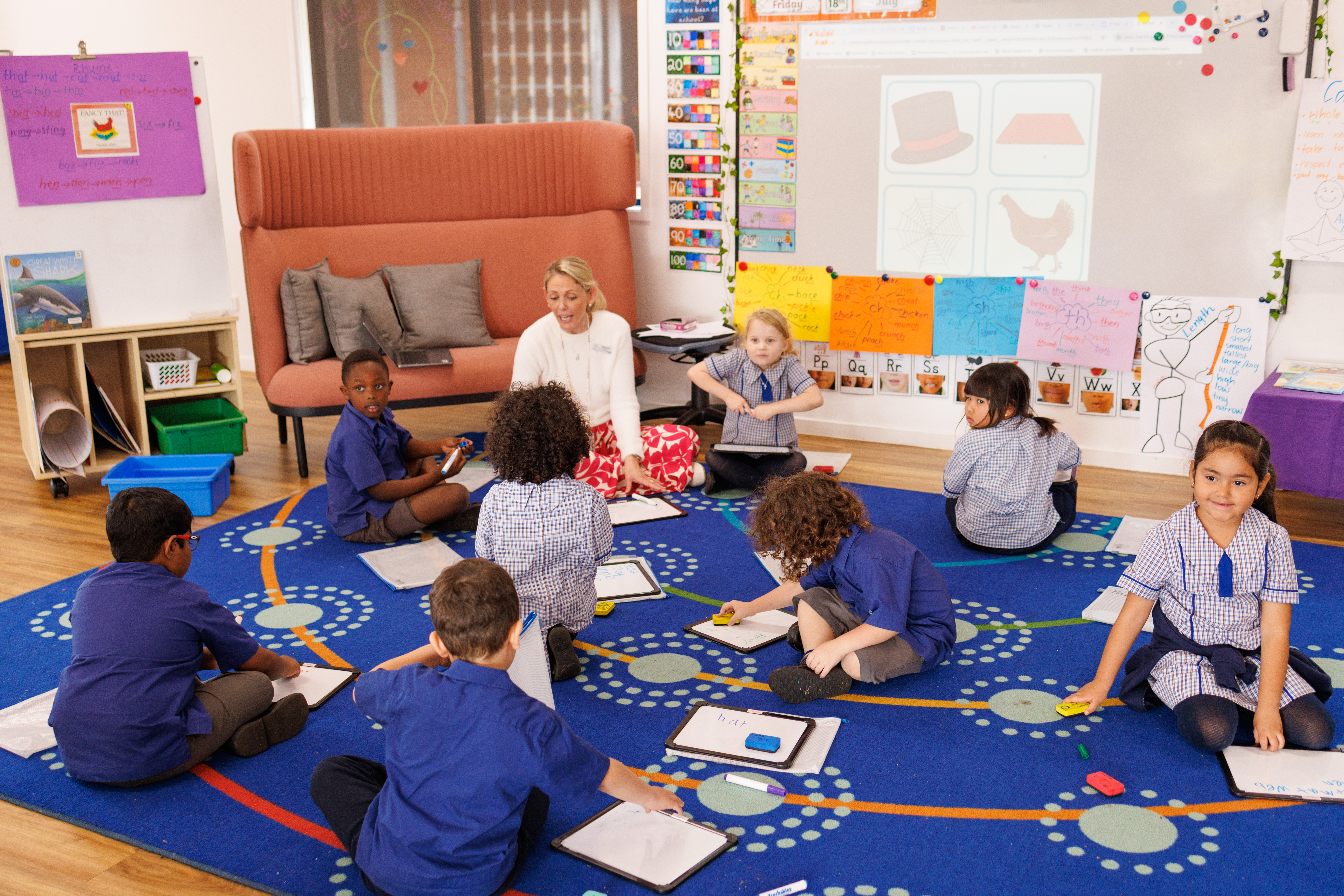 Our Early Learning Classroom teacher with students